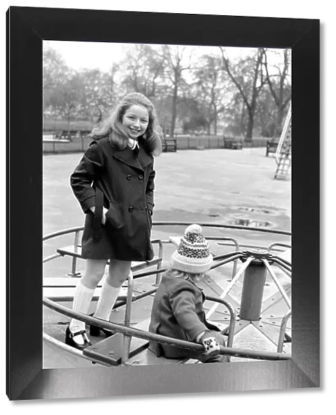 Child: Singer: Lena Zavaroni enjoying herself in Green Park, London. March 1975 75-01376
