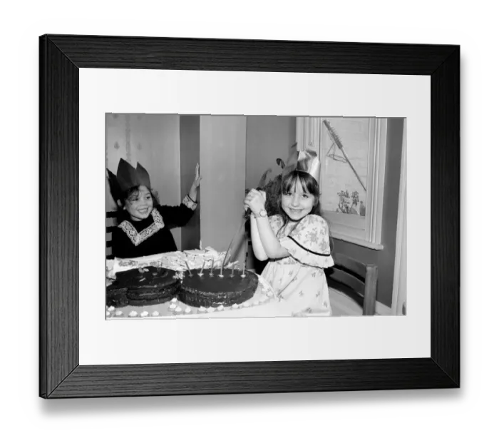 Framed Print : Childrens birthday party: The birthday girl cuts the cake. March 1981 PM 81-01186b Framed Print : Childrens birthday party: The birthday girl cuts the cake. March 1981 PM 81-01186b