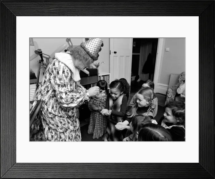 Framed Print : Child Entertainer: Mr. Blower the clown seen here at a ChildrenIs birthday party