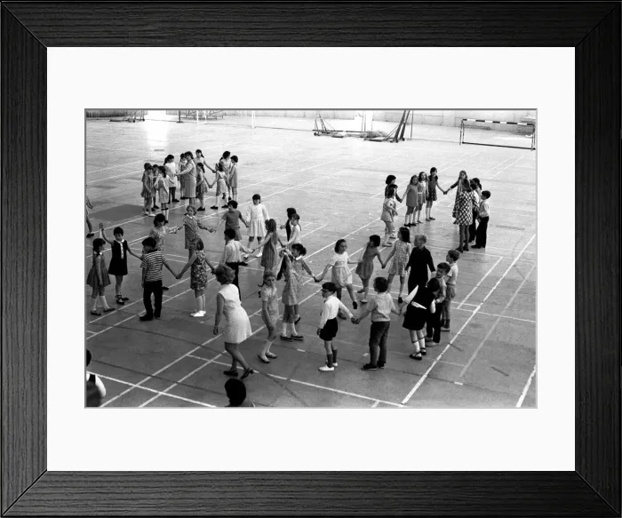 Framed Print : School children take part in an end of school year dance at the Lightfoot Stadium in