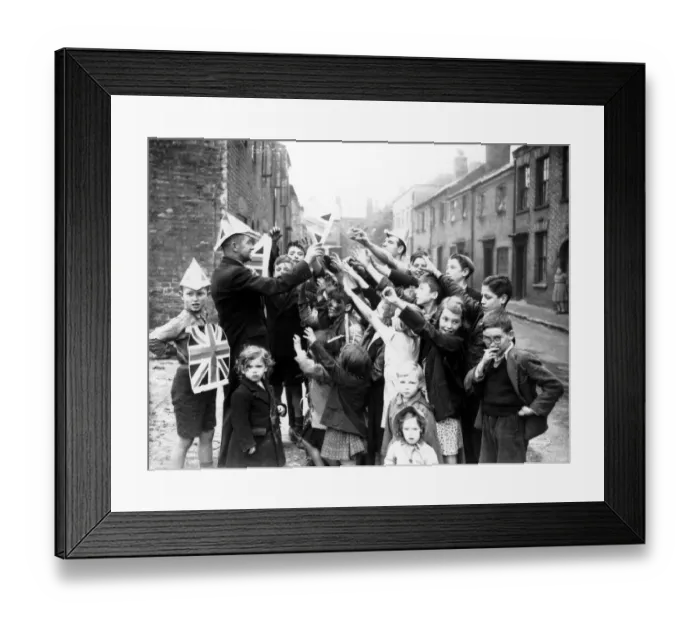 Framed Print : Coventry children are given union jack paper hats and posters to help them celebrate VE Framed Print : Coventry children are given union jack paper hats and posters to help them celebrate VE