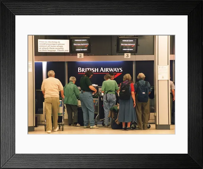 Framed Print : British Airways passengers check in at Edinburgh airport only to find their flight to