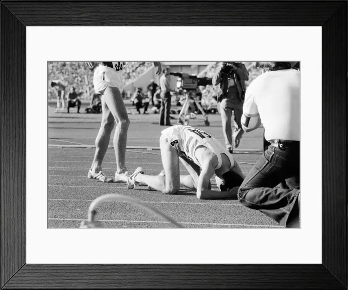 Framed Print : Sebastian Coe collapses to the ground with relief after winning the Mens 1500 metres