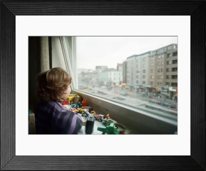 Framed Print : Child looks through window with view of Red light district in Hamburg, West Germany