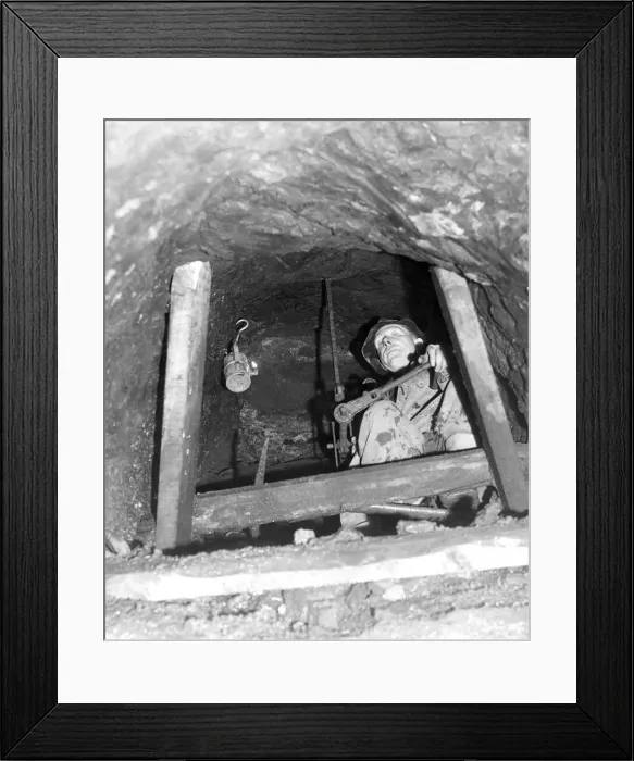Framed Print : Mr. Edwin Rutherford, 58, is seen using a hand drill in a vertical tunnel 20 feet above Framed Print : Mr. Edwin Rutherford, 58, is seen using a hand drill in a vertical tunnel 20 feet above