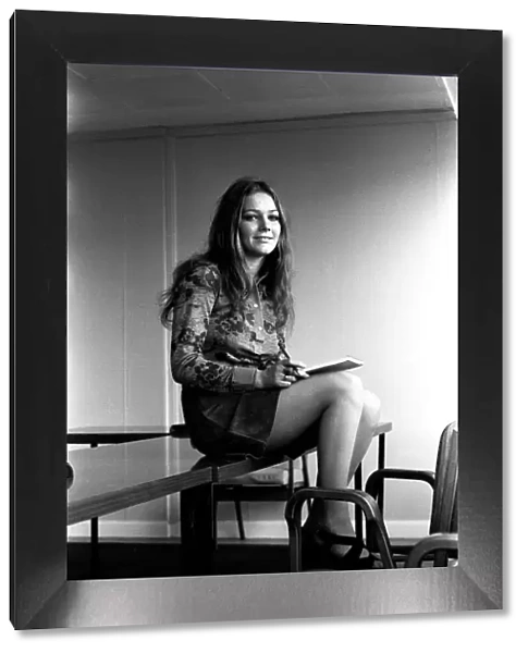 A fashion shoot from 26 October 1971 A model wearing a dress