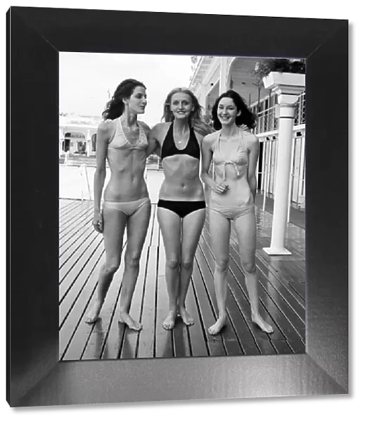 Three women modelling the latest in bikini fashions July 1970 70-6839-006