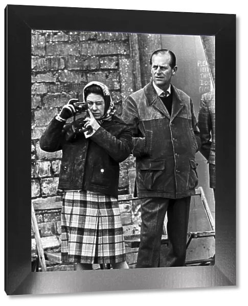Royal photographer... the Queen with Prince Philip, watching the events. April 1974