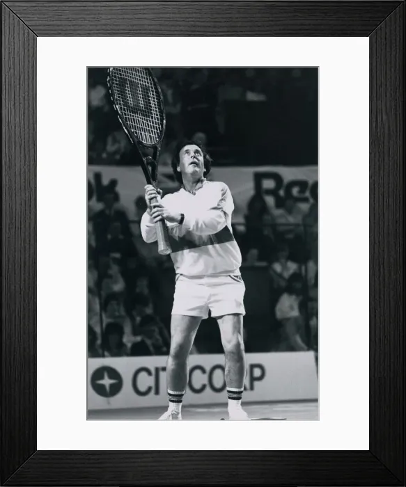 Framed Print : Television presenter and chat show host Terry Wogan playing tennis with a giant racket Framed Print : Television presenter and chat show host Terry Wogan playing tennis with a giant racket