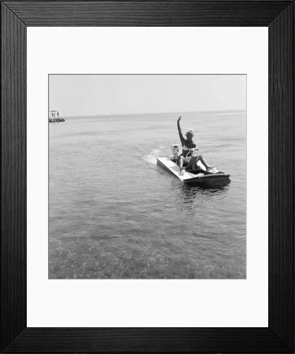 Framed Print : Woman enjoys a trip on a speedboat during a holiday on the French Riviera