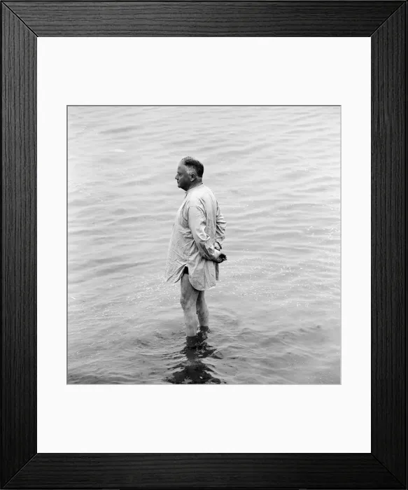 Framed Print : A holidaymaker paddles in the sea on the beach at Margate during the Summer holidays Framed Print : A holidaymaker paddles in the sea on the beach at Margate during the Summer holidays