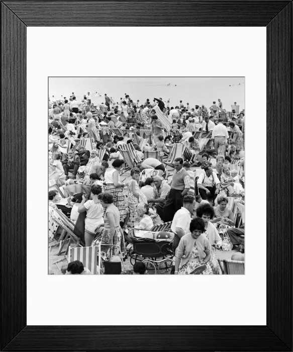 Framed Print : A busy scene on the seafront at Margate, Kent with holidaymakers packing the beach during Framed Print : A busy scene on the seafront at Margate, Kent with holidaymakers packing the beach during
