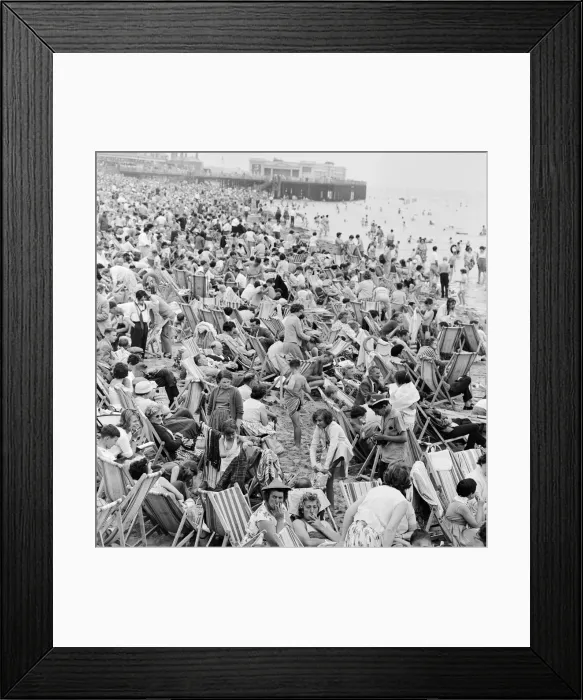 Framed Print : A busy scene on the seafront at Margate, Kent with holidaymakers packing the beach during Framed Print : A busy scene on the seafront at Margate, Kent with holidaymakers packing the beach during
