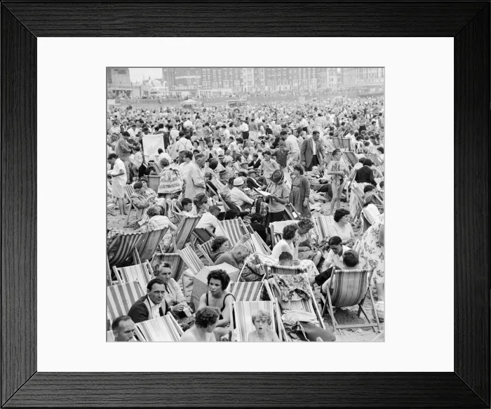 Framed Print : A busy scene on the seafront at Margate, Kent with holidaymakers packing the beach during Framed Print : A busy scene on the seafront at Margate, Kent with holidaymakers packing the beach during