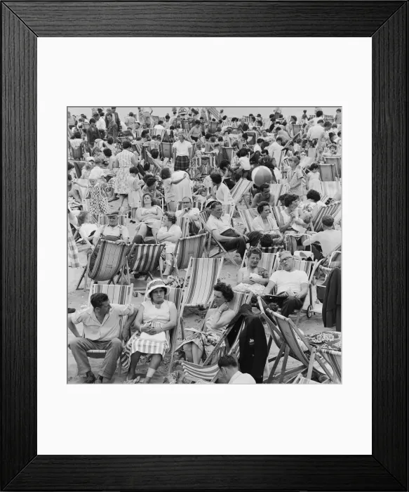 Framed Print : A busy scene on the seafront at Margate, Kent with holidaymakers packing the beach during Framed Print : A busy scene on the seafront at Margate, Kent with holidaymakers packing the beach during