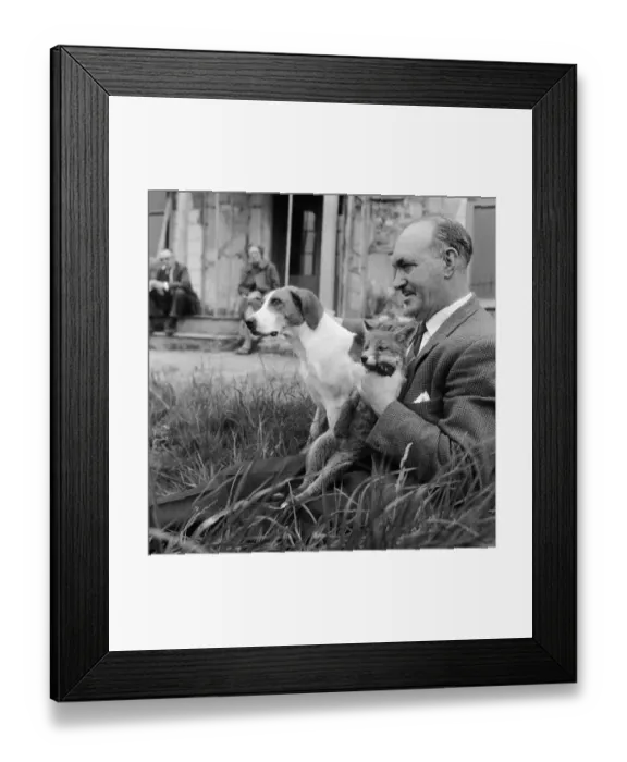 Framed Print : Vicky the fox cub and Sheba the fox hound dog at Barons Down near Dulverton in Somerset