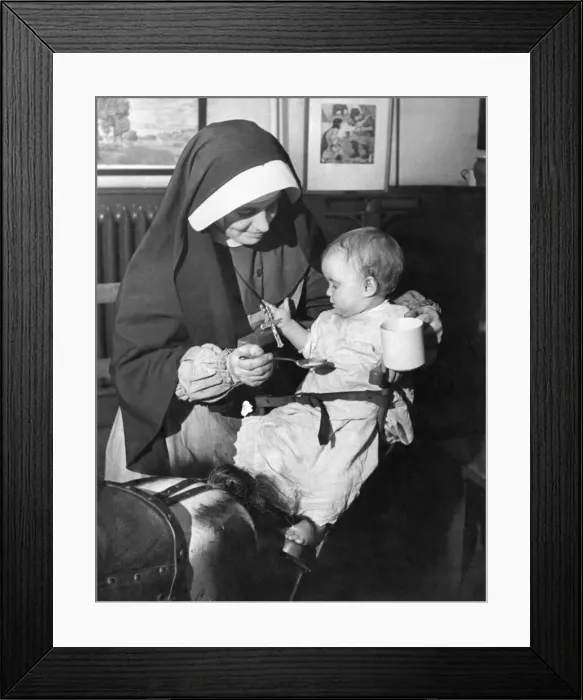 Framed Print : Sister Camillus of St. Anne with Margaret Horton aged 10 months who has just been brought Framed Print : Sister Camillus of St. Anne with Margaret Horton aged 10 months who has just been brought