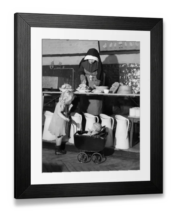 Framed Print : Sister Camillus of St. Anne prepares food at a Convent rest home for bombed Londoners Framed Print : Sister Camillus of St. Anne prepares food at a Convent rest home for bombed Londoners