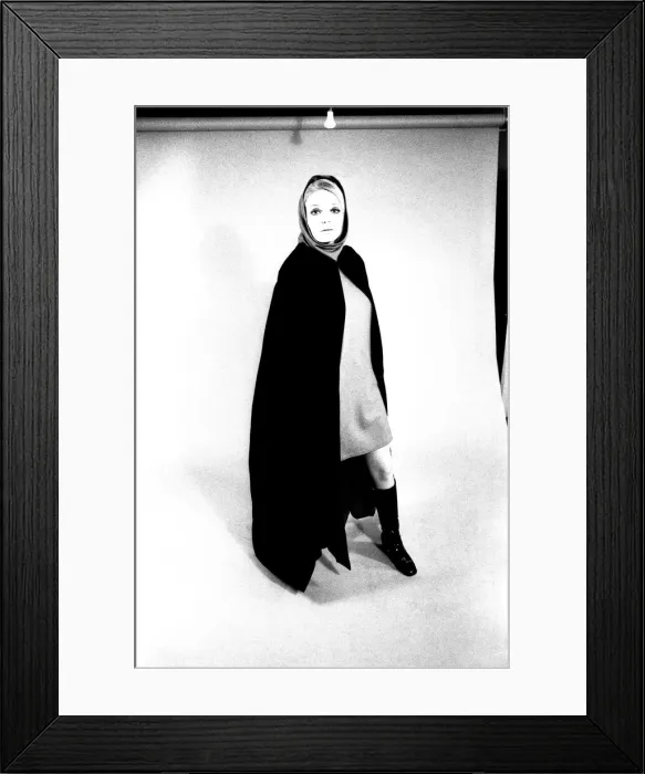 Framed Print : A fashion shoot from 13 April 1970 - A model wears a cloak and knee lenght boots