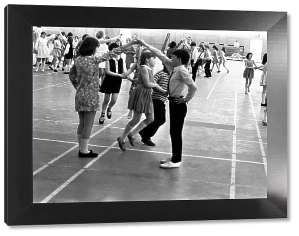 School children take part in an end of school year dance at the Lightfoot Stadium in