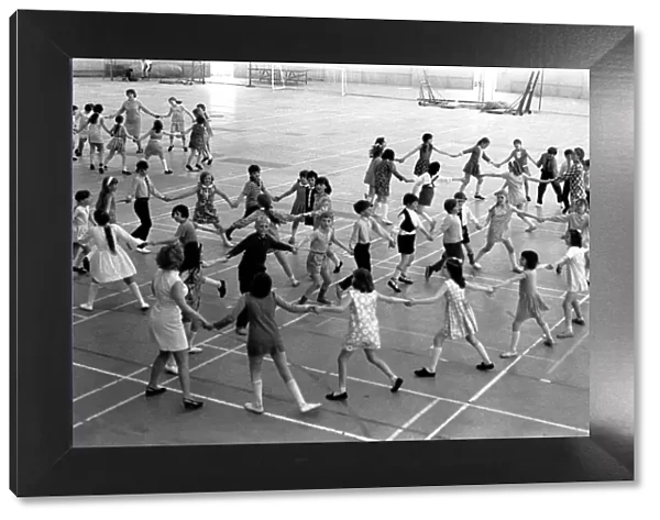 School children take part in an end of school year dance at the Lightfoot Stadium in