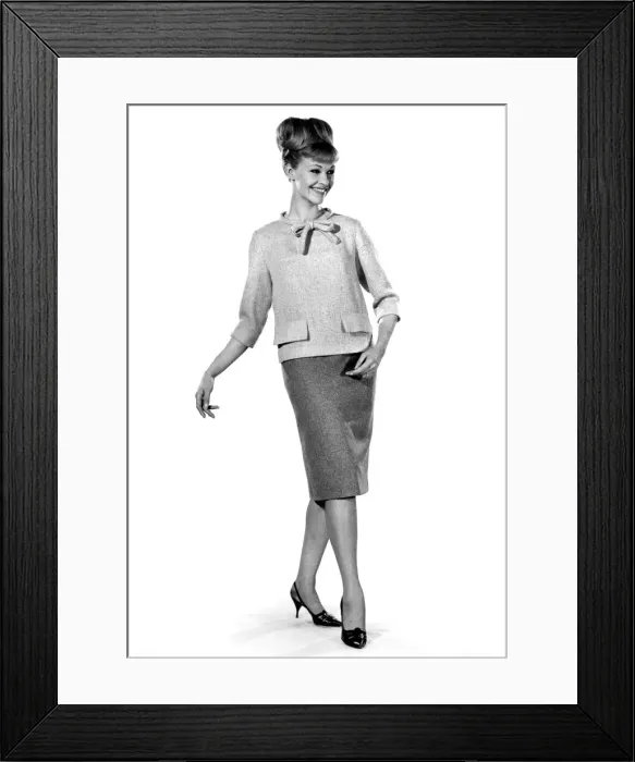 Framed Print : Jo Waring modeling a blouse and skirt ideal for the office. November 1964 P007534 Framed Print : Jo Waring modeling a blouse and skirt ideal for the office. November 1964 P007534