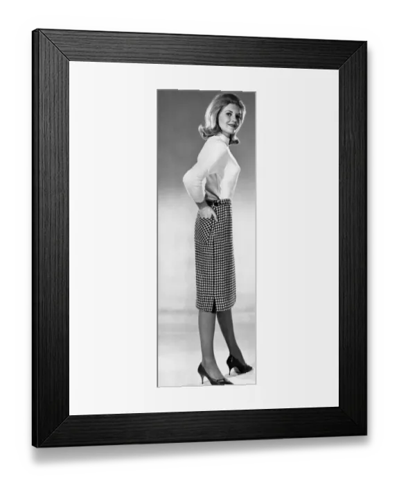 Framed Print : Clothing Fashion: Maureen Walker modeling a check pencil skirt Framed Print : Clothing Fashion: Maureen Walker modeling a check pencil skirt