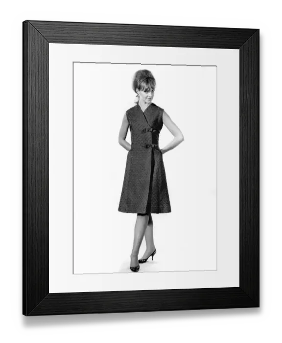 Framed Print : Reveille Fashions: Ann Robert wearing a threee quarters length summer sleeveless dress