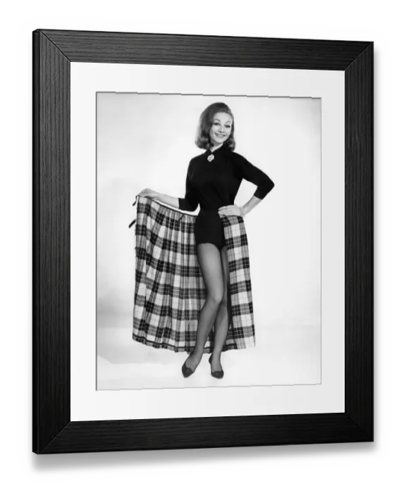 Framed Print : Reveille Fashions 1964. Mannequin modeling a blouse and a wrap-around full length tartan Framed Print : Reveille Fashions 1964. Mannequin modeling a blouse and a wrap-around full length tartan