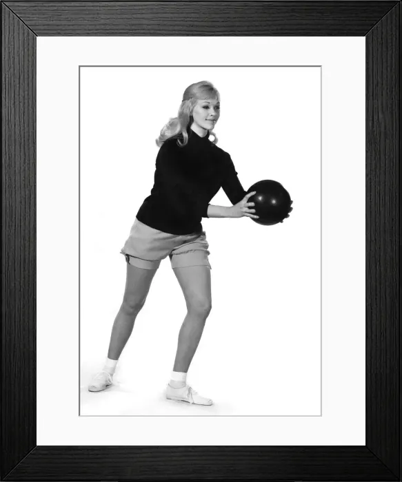 Framed Print : Reveille Fashions 1964: Jo Waring wearing a bowling suit of shorts and jumper Framed Print : Reveille Fashions 1964: Jo Waring wearing a bowling suit of shorts and jumper