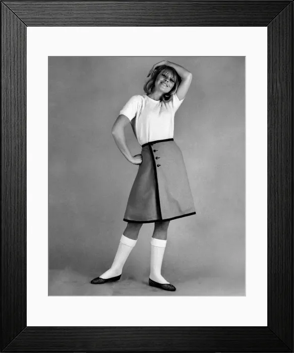 Framed Print : Reveille Fashions 1965: Marilyn Rickards modeling a white t-shirt and knee length skirt