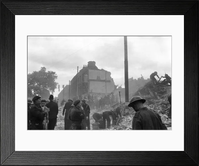 Framed Print : V1 flying bomb falls on dwelling houses and shops somewhere in Southern England