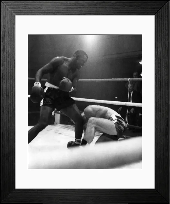 Framed Print : Jim Cooper goes down for a count of nine in the third round of his heavyweight fight Framed Print : Jim Cooper goes down for a count of nine in the third round of his heavyweight fight