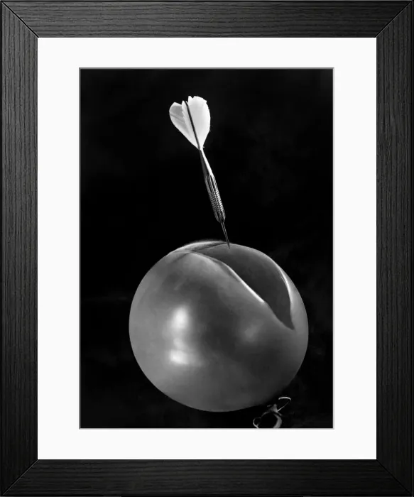 Framed Print : Swiftly. The cut divides the flimsy toy, while the dart is poised above