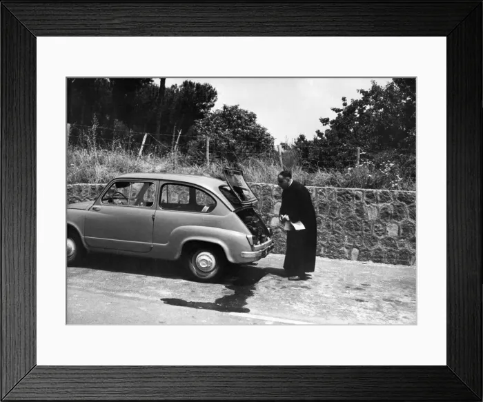 Framed Print : An Italian priest has trouble with his car on the Autostrada outside Naples Framed Print : An Italian priest has trouble with his car on the Autostrada outside Naples