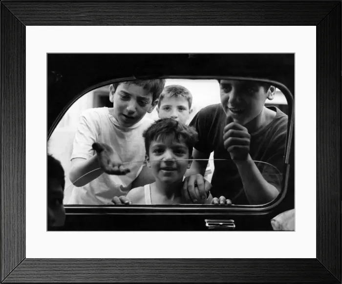 Framed Print : Boys from the slum areas of Naples in southern Italy beg for money through car windows Framed Print : Boys from the slum areas of Naples in southern Italy beg for money through car windows