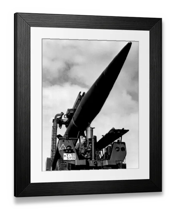Framed Print : A German gunner checks a Pershing missile before the launching on South Uist Framed Print : A German gunner checks a Pershing missile before the launching on South Uist