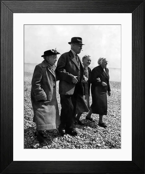 Framed Print : Old people go for walk on the pebbled ground at a Holiday Hotel in Boxhill