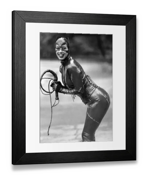 Framed Print : Catwoman model Tina Shaw displays her charms in the latest latex catsuit look