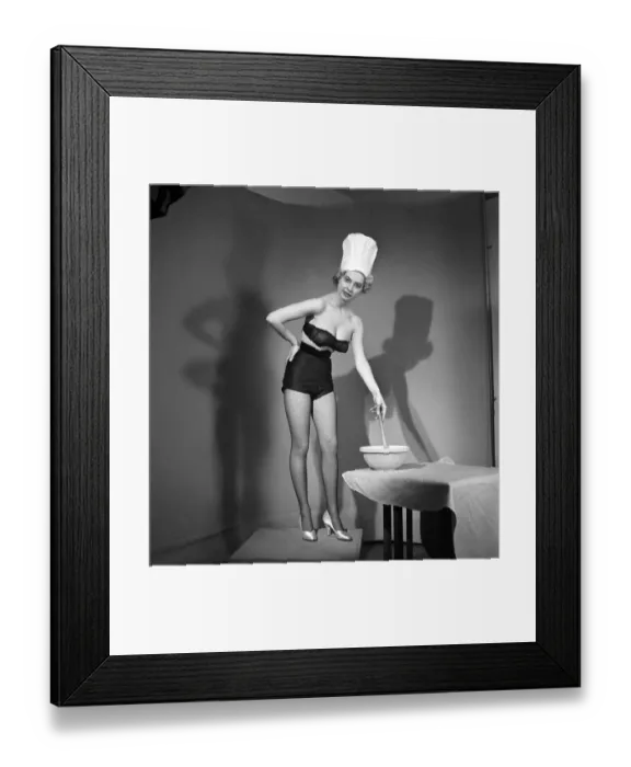Framed Print : Model seen here in a chef hats making pancake mix, Tuesday 1st March 1960