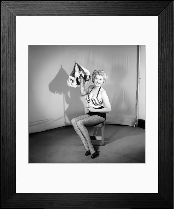 Framed Print : Woman wearing bra and skirt holding parasol. 1959 Framed Print : Woman wearing bra and skirt holding parasol. 1959