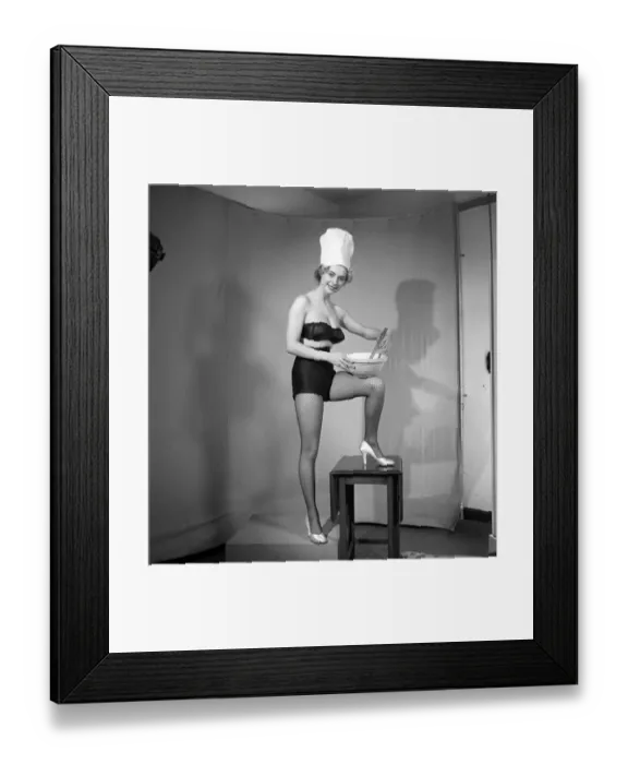Framed Print : Model seen here in a chef hats making pancake mix, Tuesday 1st March 1960 Framed Print : Model seen here in a chef hats making pancake mix, Tuesday 1st March 1960