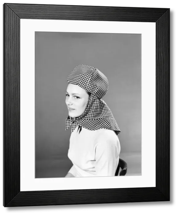 Framed Print : Model wearing hat that can be converted into a hooded cape. 1959 B1685-004 Framed Print : Model wearing hat that can be converted into a hooded cape. 1959 B1685-004