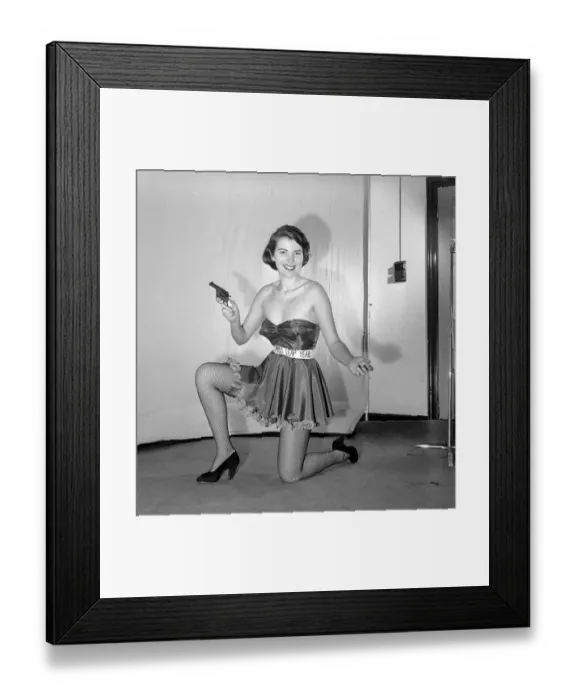 Framed Print : Miss Leap Year: Belinda Penelope seen here proposing to boyfriend holding a gun