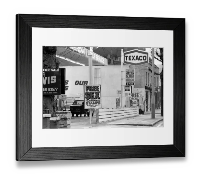 Framed Print : Sex'Garage Sign. In a bid to get business in the Easter Petrol War