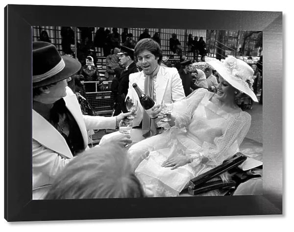 The Easter parade, Battersea Park. Film star Carol Baker gets a drink of champagne before