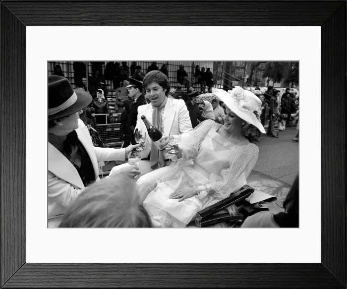 Framed Print : The Easter parade, Battersea Park. Film star Carol Baker gets a drink of champagne before