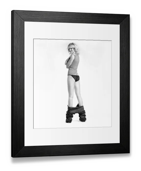 Framed Print : Fashion: Clothing: A woman pulling up a pair of denim jeans. January 1981 81-00051-003