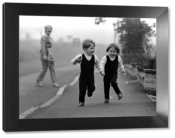 Children: Boy and girl: Young twins holding hands, running with happy expressions