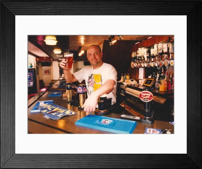 Framed Print : Angelic Upstarts - chatting from behind the bar of his own idyllic country pub Framed Print : Angelic Upstarts - chatting from behind the bar of his own idyllic country pub